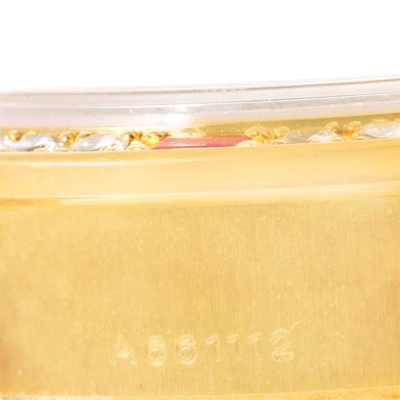 This close-up image shows the side view of the Rolex President 79068 Women's Yellow Gold Mother of Pearl Dial 79068 Women's Yellow Gold Mother of Pearl Dial model watch, focusing on the serial number engraving and partial bezel detail.