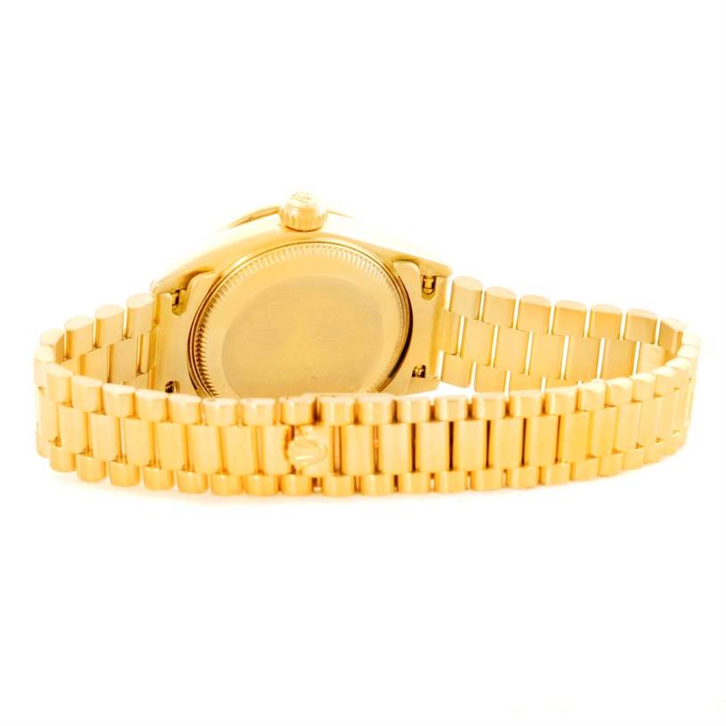 This image shows the back and band of a Rolex President 79068 Women's Yellow Gold Mother of Pearl Dial 79068 Women's Yellow Gold Mother of Pearl Dial model watch from a rear angle.