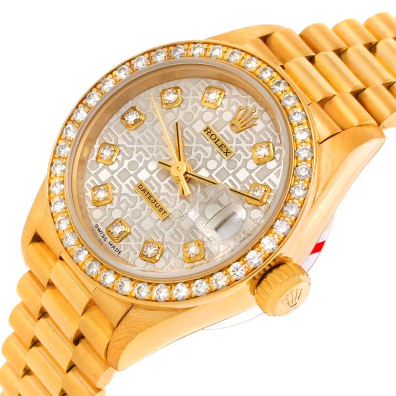 This image shows a close-up angle of a Rolex President 69138 Women's Yellow Gold Beige Dial 69138 Women's Yellow Gold Beige Dial model watch, highlighting its diamond bezel, dial, and crown.
