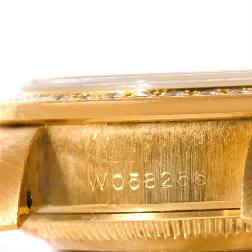 The image shows a close-up side angle of a Rolex President 69138 Women's Yellow Gold Beige Dial 69138 Women's Yellow Gold Beige Dial model watch, focusing on the case and serial number.