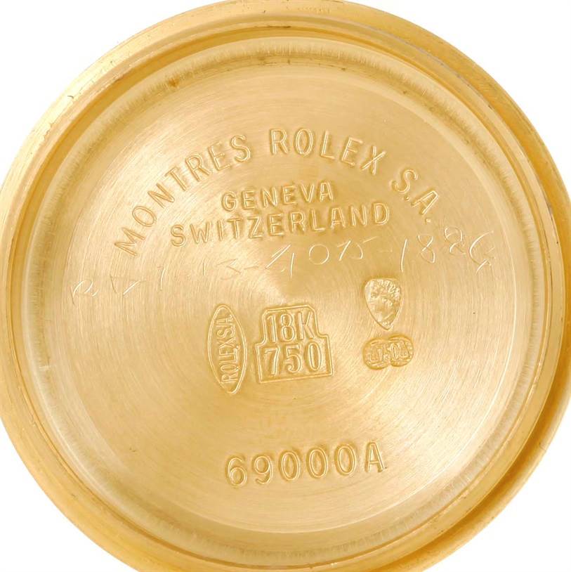 This is an inside view of the case back for a Rolex President 79068 Women's Yellow Gold Mother of Pearl Dial 79068 Women's Yellow Gold Mother of Pearl Dial model watch, displaying engravings and gold hallmarks.