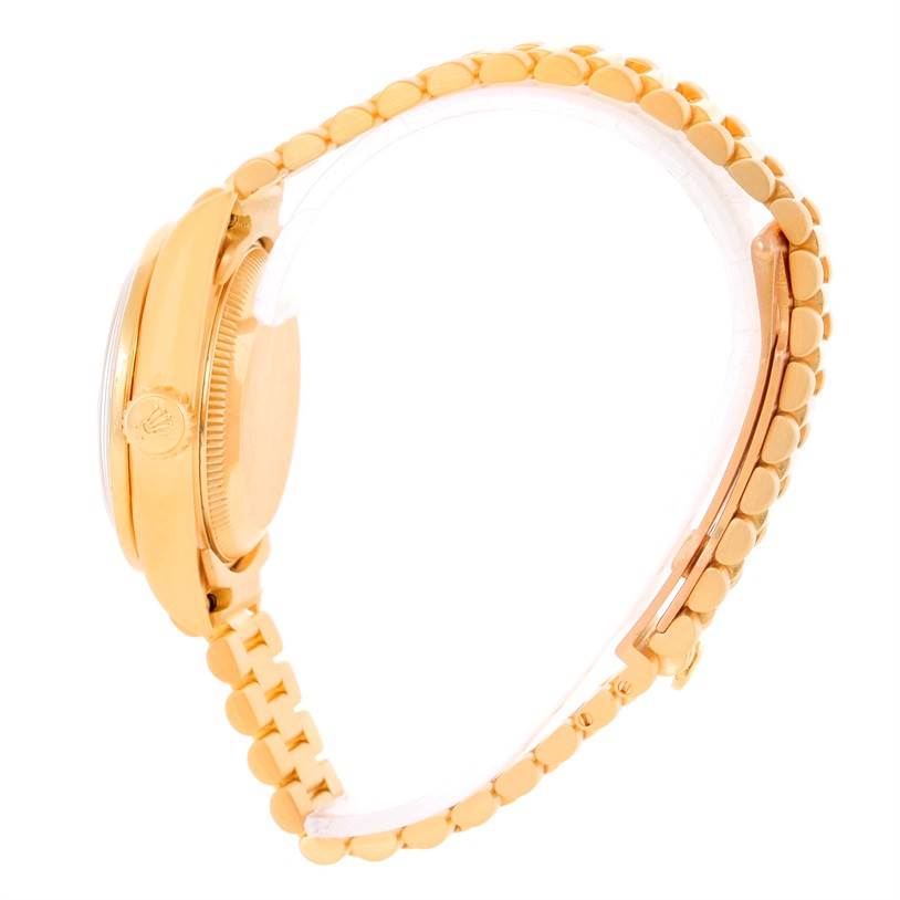 The image shows a side view of a Rolex President 79068 Women's Yellow Gold Mother of Pearl Dial 79068 Women's Yellow Gold Mother of Pearl Dial model, highlighting the bezel, crown, and bracelet.