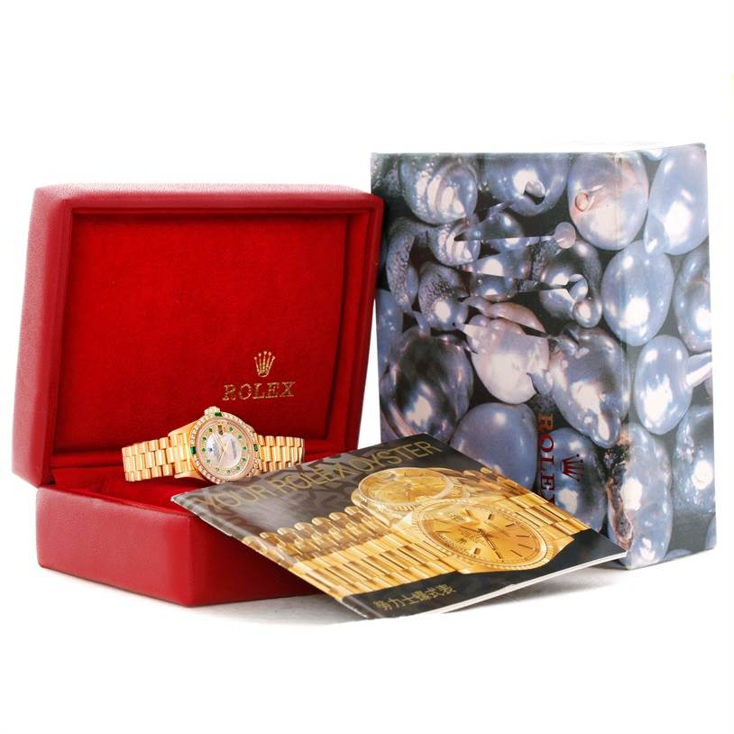 The image shows the Rolex President 79068 Women's Yellow Gold Mother of Pearl Dial 79068 Women's Yellow Gold Mother of Pearl Dial model watch in an open red case, with a booklet and outer packaging visible.