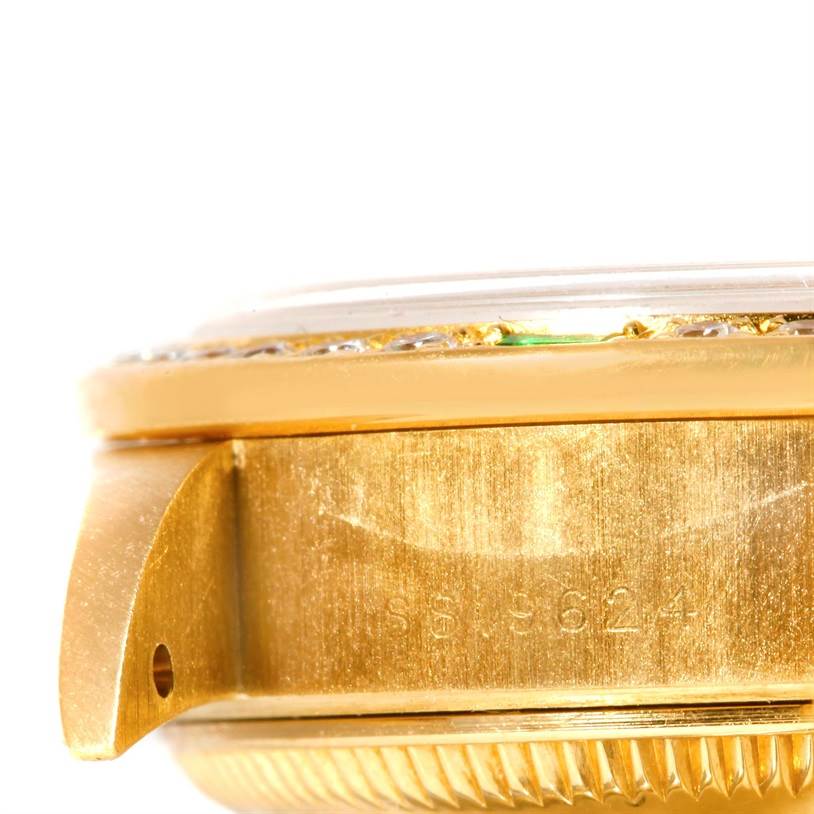 This close-up image shows the side of a Rolex President 79068 Women's Yellow Gold Mother of Pearl Dial 79068 Women's Yellow Gold Mother of Pearl Dial watch, focusing on the casing and serial number.