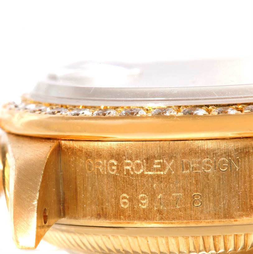 This is a close-up side view of a Rolex President 69178 Women's Champagne Dial 69178 Women's Champagne Dial model watch, showing the bezel and part of the case with the engraved details.