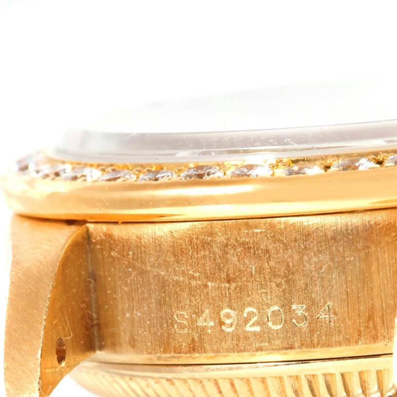 The image shows a close-up side view of the case and bezel of a Rolex President 69178 Women's Champagne Dial 69178 Women's Champagne Dial model watch, highlighting its serial number.