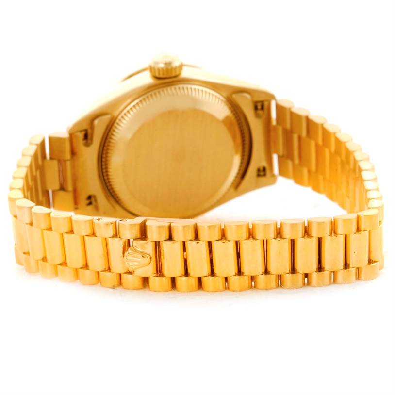 The image shows the back and band of a Rolex President 69178 Women's Champagne Dial 69178 Women's Champagne Dial model watch at a slight angle.