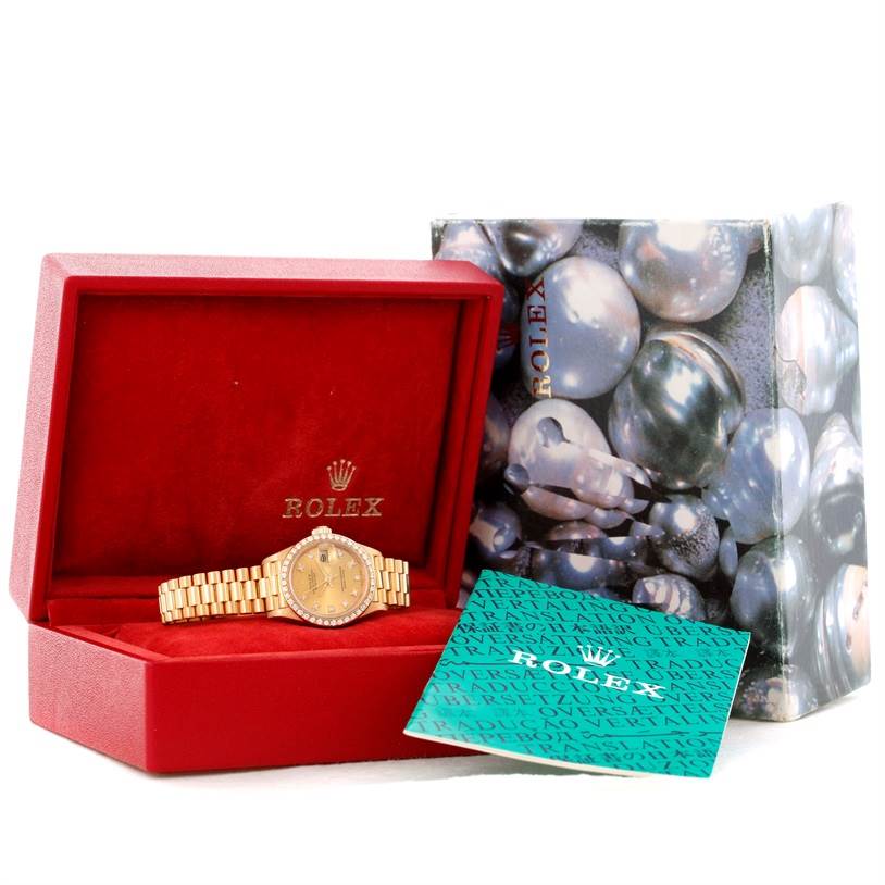 The image shows a Rolex President 69178 Women's Champagne Dial 69178 Women's Champagne Dial model watch in its red case, along with the outer box and documentation.