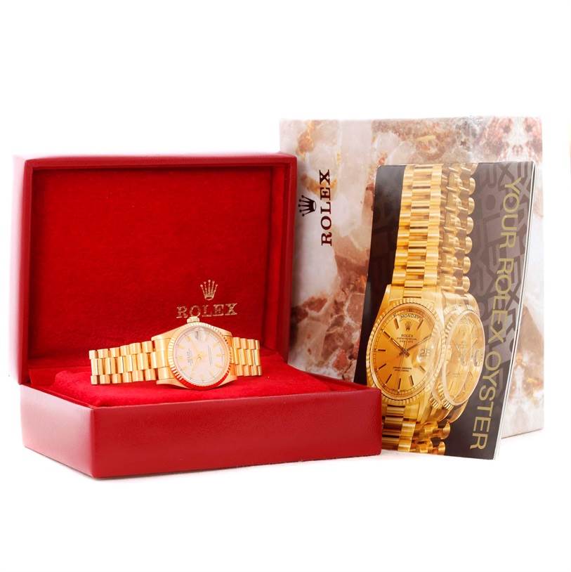 The Rolex President 68278 Women's Yellow Gold Beige Dial 68278 Women's Yellow Gold Beige Dial model watch is displayed in its open red box, alongside an information booklet.