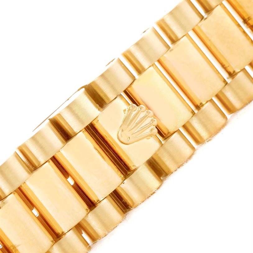 This image shows a close-up of the bracelet of a Rolex President 68278 Women's Yellow Gold Beige Dial 68278 Women's Yellow Gold Beige Dial model watch.