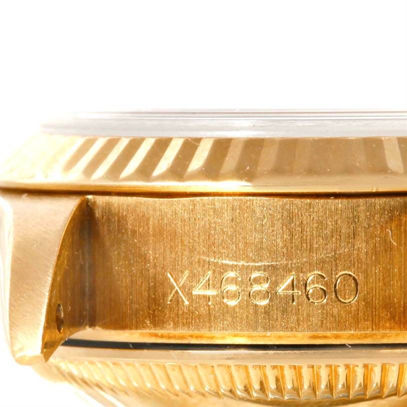 This image shows a close-up side view of a Rolex President 69178 Women's Yellow Gold Champagne Dial 69178 Women's Yellow Gold Champagne Dial model, focusing on the case and serial number.