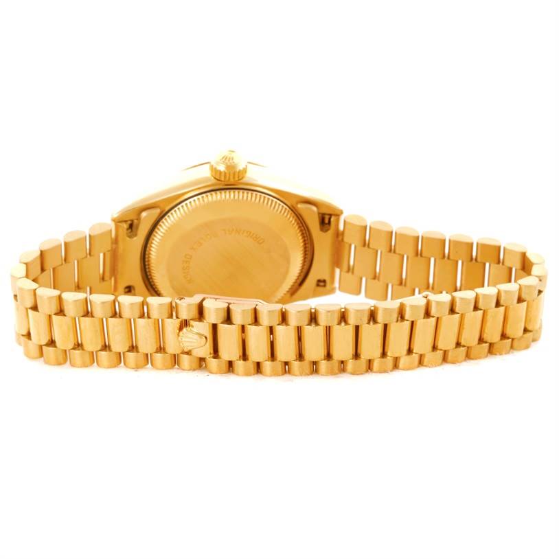 This image shows the back view of a Rolex President 69178 Women's Yellow Gold Champagne Dial 69178 Women's Yellow Gold Champagne Dial model watch, highlighting the case back and bracelet.