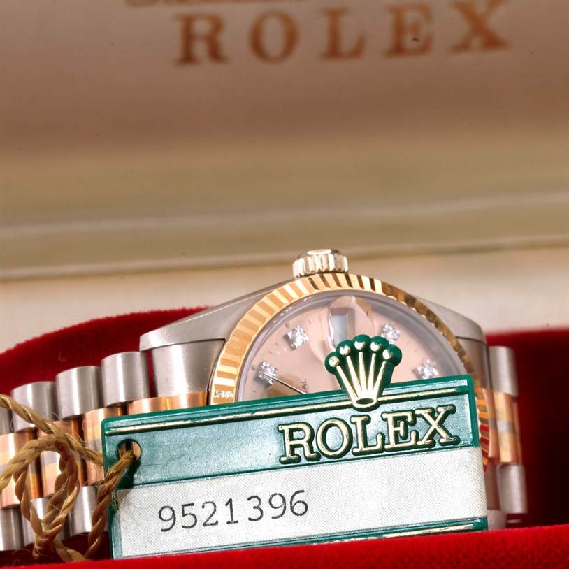 The image shows a partial view of the Rolex President 68279 Women's White Gold Brown Dial 68279 Women's White Gold Brown Dial model watch, focusing on the bezel, dial, and bracelet with a Rolex tag.