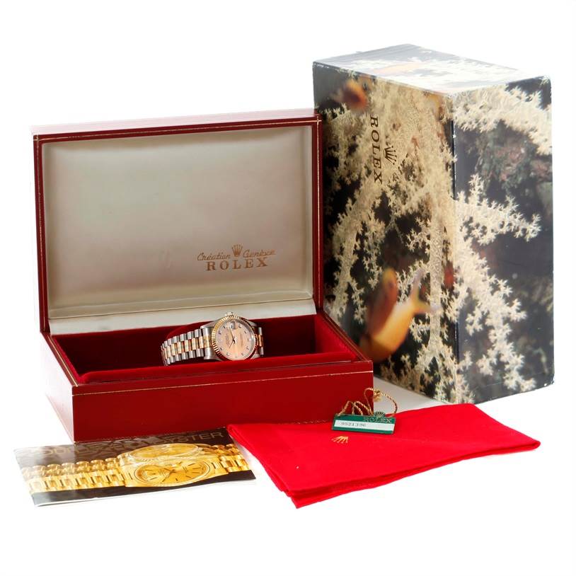 The image shows a Rolex President 68279 Women's White Gold Brown Dial 68279 Women's White Gold Brown Dial watch in its open red box, accompanied by a booklet, tag, and red cleaning cloth.