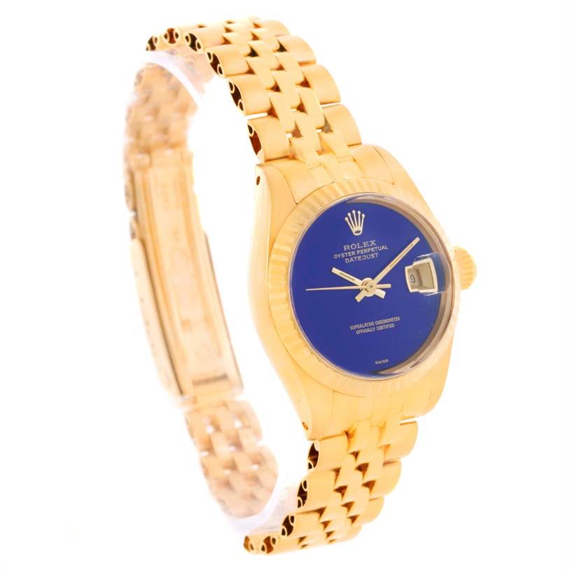 This image shows a Rolex President 6917 Women's Yellow Gold Blue Dial 6917 Women's Yellow Gold Blue Dial model watch from a side angle, highlighting its gold bracelet and blue dial.