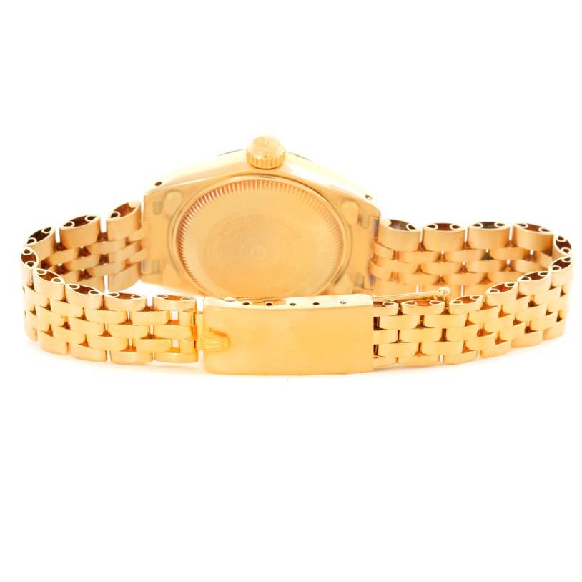 The image shows the back and the clasp of a Rolex President 6917 Women's Yellow Gold Blue Dial 6917 Women's Yellow Gold Blue Dial model watch, emphasizing the bracelet and case back.