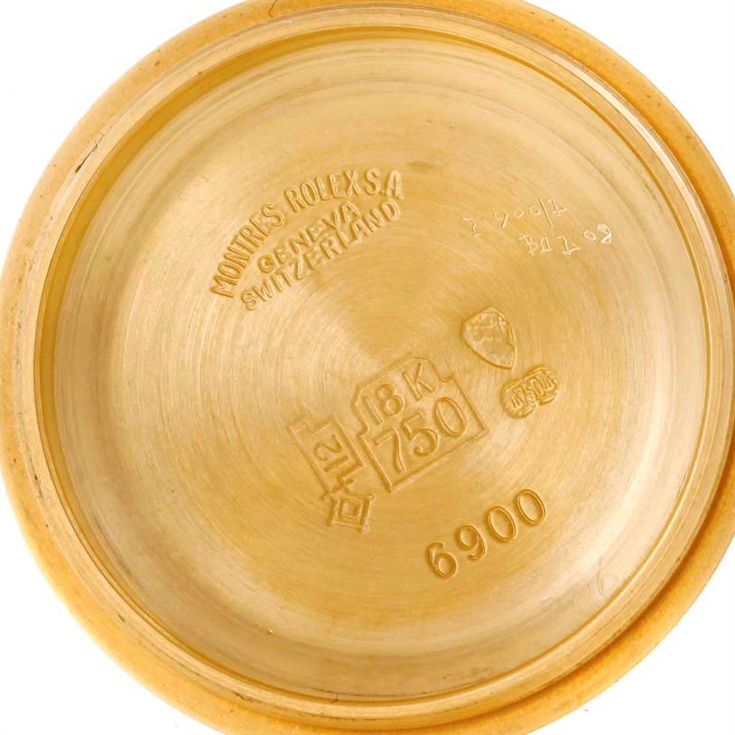 This image shows the interior case back of a Rolex President 6917 Women's Yellow Gold Brown Dial 6917 Women's Yellow Gold Brown Dial model watch, indicating it's made of 18K gold.