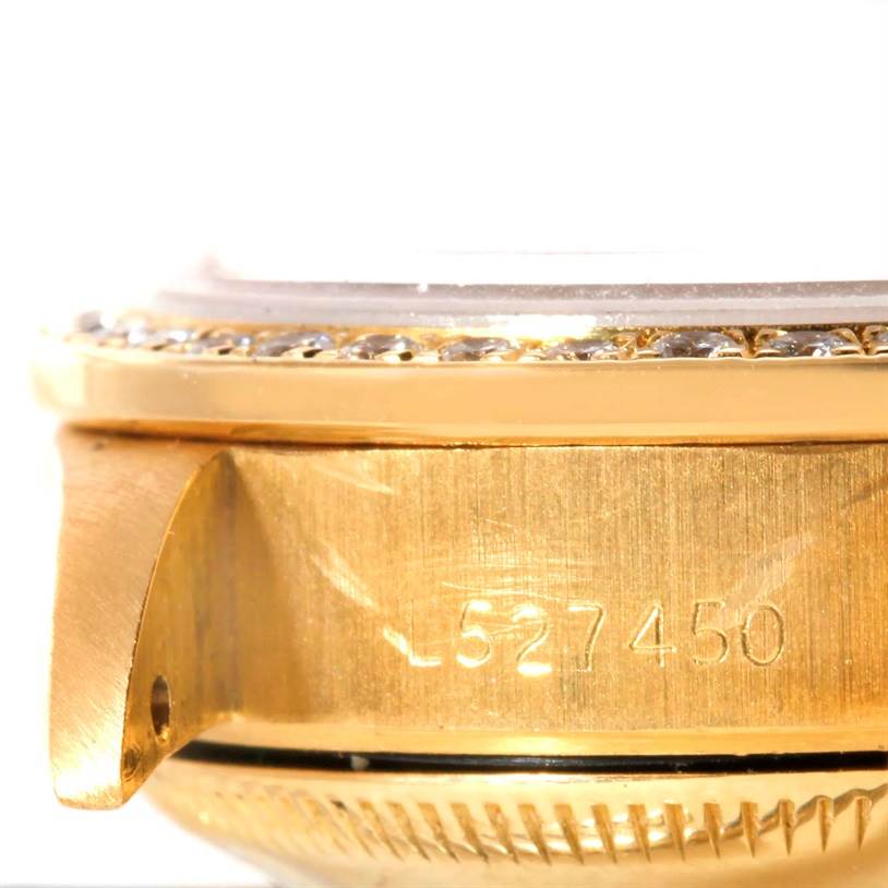 This close-up image shows the side bezel, case, and partial serial number of the Rolex President 69138 Women's Yellow Gold Champagne Dial 69138 Women's Yellow Gold Champagne Dial model watch.