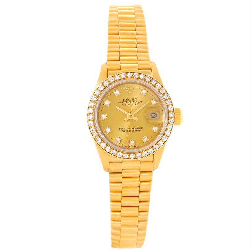 The image shows a front view of the Rolex President 69138 Women's Yellow Gold Champagne Dial 69138 Women's Yellow Gold Champagne Dial model watch, featuring its gold bracelet, diamond-studded bezel, and date display.