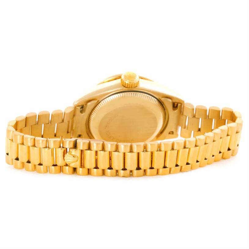 The image shows the back view of a Rolex President 69138 Women's Yellow Gold Champagne Dial 69138 Women's Yellow Gold Champagne Dial model watch, highlighting its case back and gold bracelet.