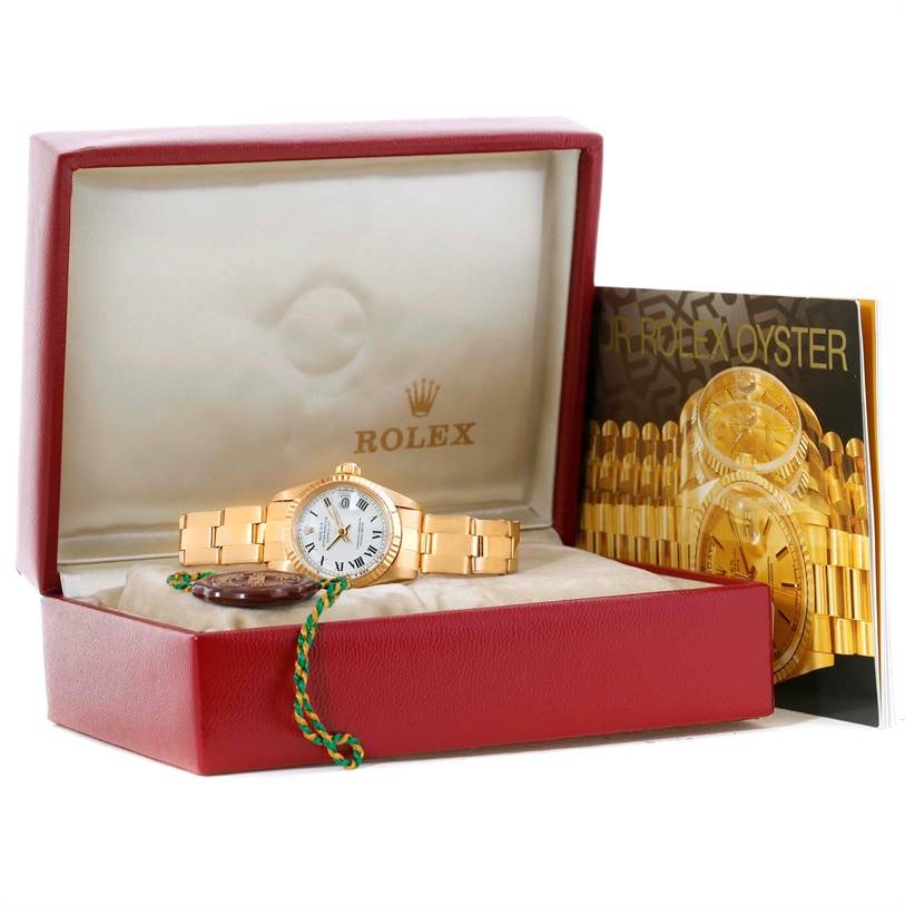This Rolex President 6917 Women's Yellow Gold White Dial 6917 Women's Yellow Gold White Dial model is shown in its box with a booklet, tags, and the watch displayed front-facing.
