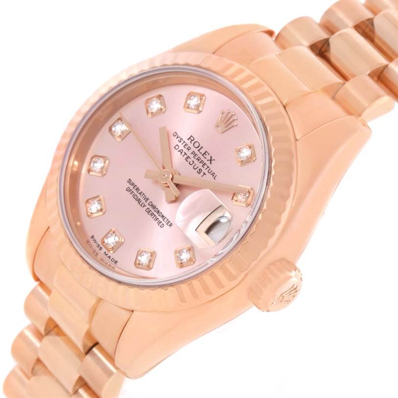 The image shows a close-up angle of a Rolex President 179175 Women's Rose Gold Pink Dial 179175 Women's Rose Gold Pink Dial model watch, highlighting the dial, crown, and part of the bracelet.