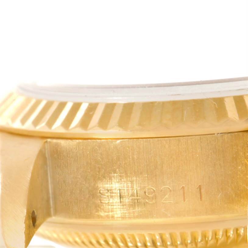The image displays a close-up of the side and bezel of a Rolex President 69178 Women's Yellow Gold Champagne Dial 69178 Women's Yellow Gold Champagne Dial watch, emphasizing its fluted edge and case details.