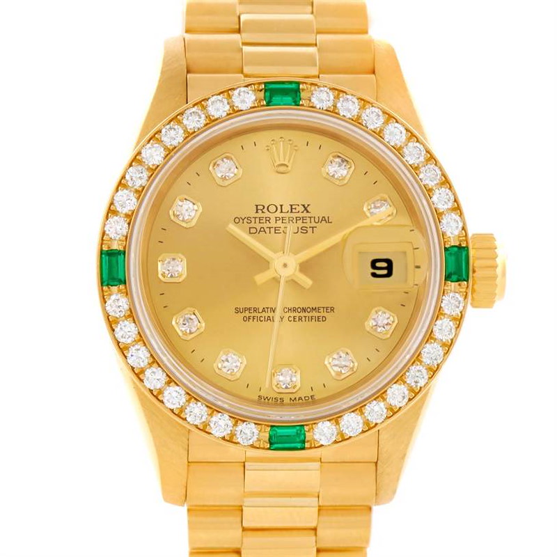 The image shows a frontal view of a Rolex President model watch, featuring a gold dial, diamond bezel, and day-date display.