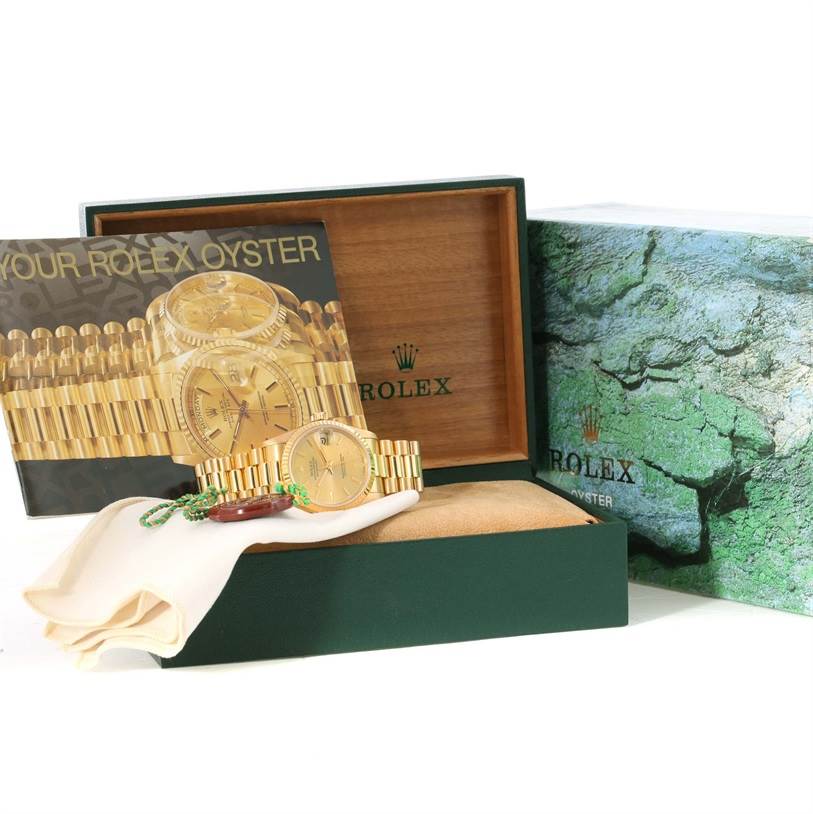 The Rolex President 68278 Men
s Yellow Gold Champagne Dial 68278 Men
s Yellow Gold Champagne Dial watch is displayed with its box, booklet, and cloth, showing its front and bracelet.