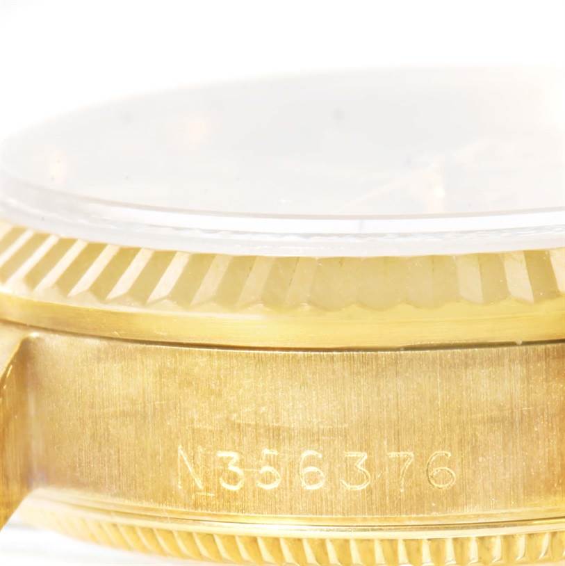 This image shows a close-up side view of the case and bezel of a Rolex President 68278 Men
s Yellow Gold Champagne Dial 68278 Men
s Yellow Gold Champagne Dial model watch, including the serial number.