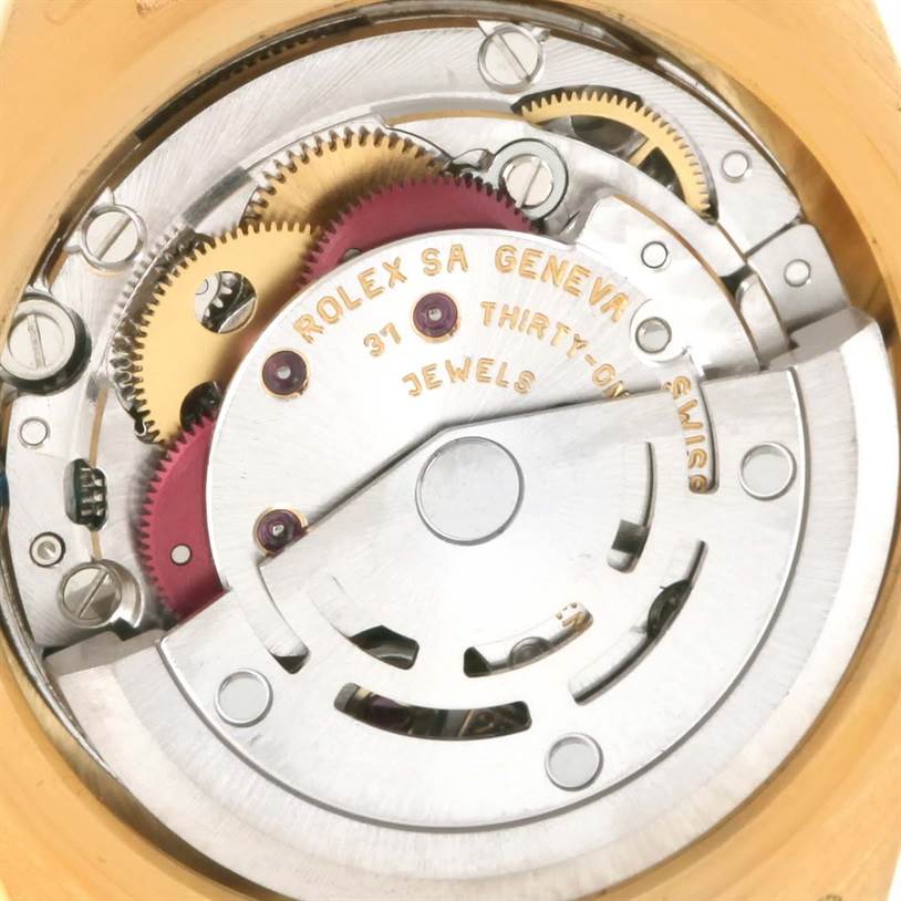 The image shows the internal mechanism of a Rolex President 79258 Women's Yellow Gold Champagne Dial 79258 Women's Yellow Gold Champagne Dial model watch, highlighting the gears and movements.