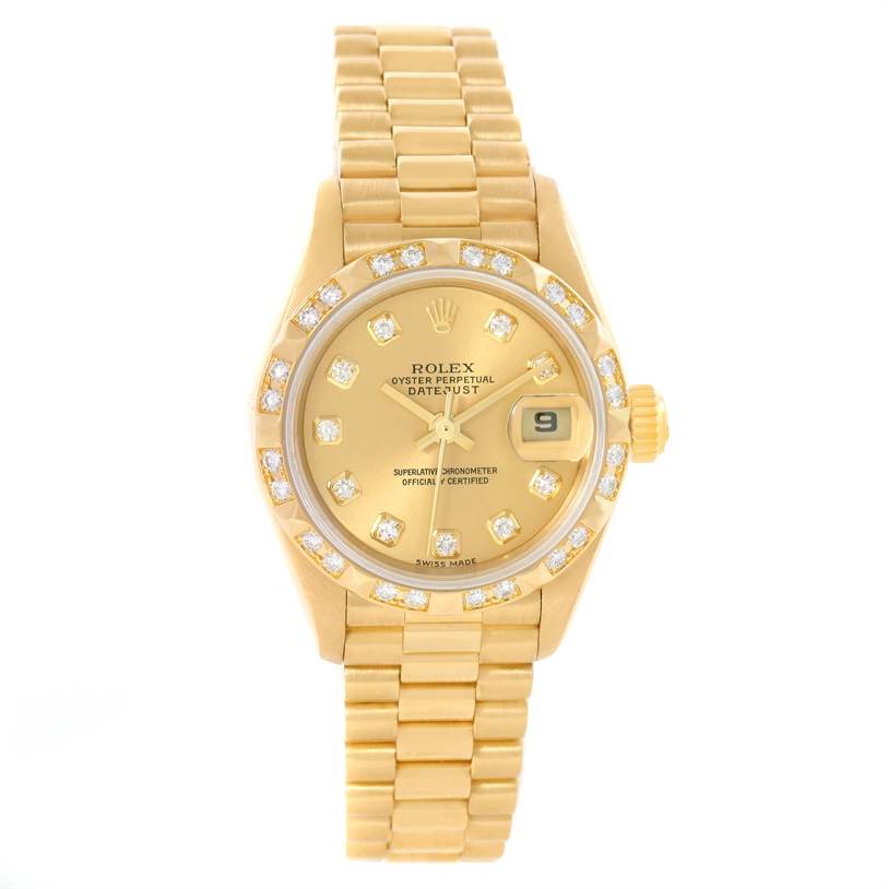 The Rolex President 79258 Women's Yellow Gold Champagne Dial 79258 Women's Yellow Gold Champagne Dial model watch is shown from the front, displaying its gold bracelet, diamond bezel, date window, and gold dial.