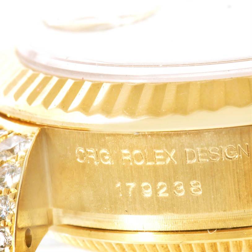 This close-up image shows the side of the case and the bezel of the Rolex President 179238 Women
s Yellow Gold Mother of Pearl Dial 179238 Women
s Yellow Gold Mother of Pearl Dial model watch with the design number engraved.