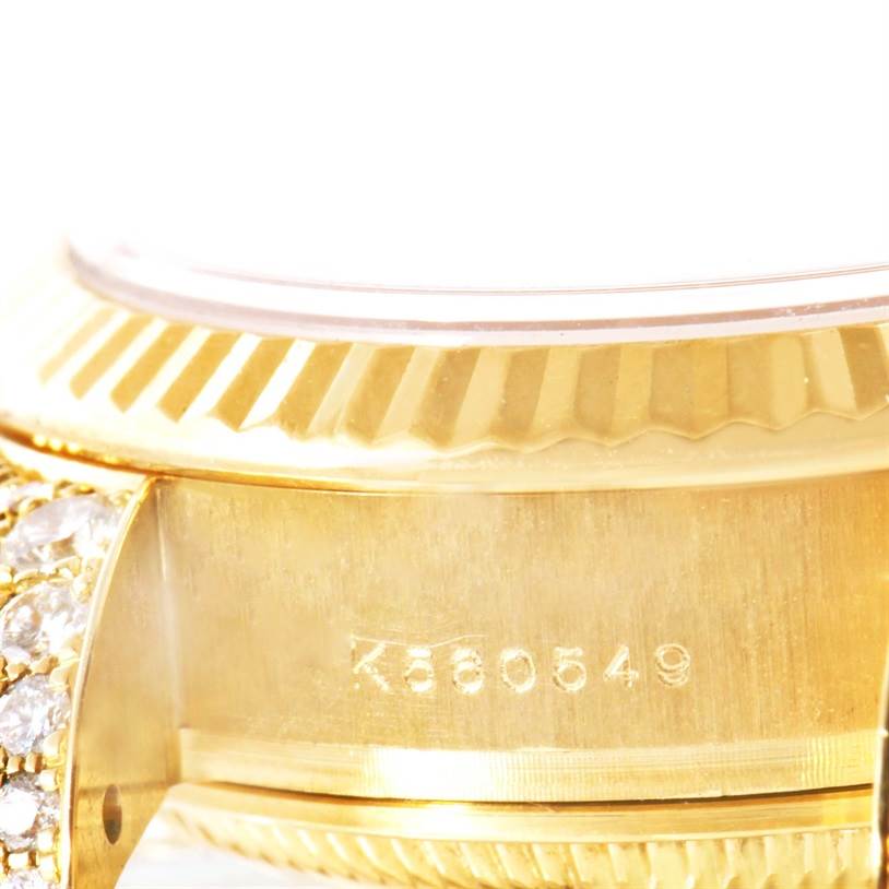 This close-up image of the Rolex President 179238 Women
s Yellow Gold Mother of Pearl Dial 179238 Women
s Yellow Gold Mother of Pearl Dial model shows the side of the watch case, partial bezel, and part of the bracelet with diamonds.