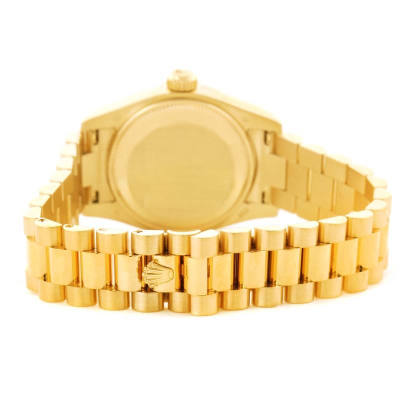 The image shows the back case and bracelet of a Rolex President 179238 Women
s Yellow Gold Mother of Pearl Dial 179238 Women
s Yellow Gold Mother of Pearl Dial model watch, focusing on the clasp and links.
