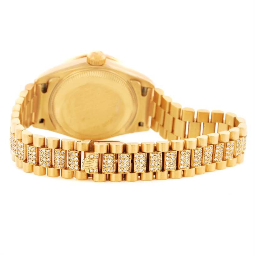 The image shows the back and bracelet of the Rolex President 69158 Women's Yellow Gold Black Dial 69158 Women's Yellow Gold Black Dial model watch, highlighting the gold and diamond accents.