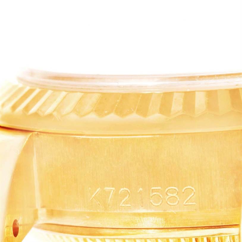 This close-up shows the side and bezel with serial number of a Rolex President 179178 Women's Yellow Gold Champagne Dial 179178 Women's Yellow Gold Champagne Dial model watch.