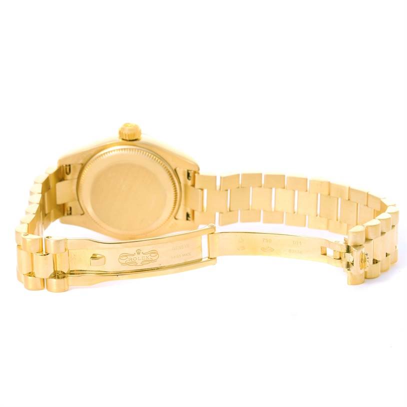 The image displays the underside of a Rolex President 179178 Women's Yellow Gold Champagne Dial 179178 Women's Yellow Gold Champagne Dial model watch, showcasing the clasp and back of the watch case.