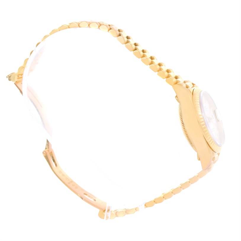 The image shows a side view of a Rolex President 79178 Women's Yellow Gold Beige Dial 79178 Women's Yellow Gold Beige Dial model, highlighting its gold bracelet and partial watch case.