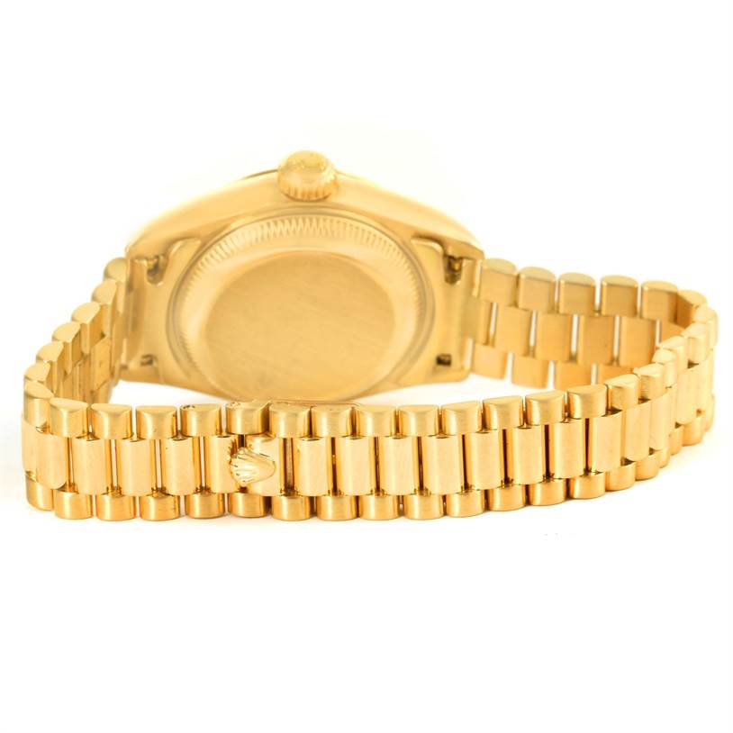 The image shows the back view and bracelet of a Rolex President 79178 Women's Yellow Gold Beige Dial 79178 Women's Yellow Gold Beige Dial model watch.