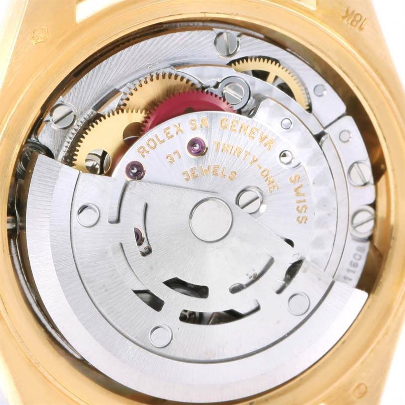 This image shows the movement mechanism of a Rolex President 79178 Women's Yellow Gold Beige Dial 79178 Women's Yellow Gold Beige Dial model watch from the back, showcasing intricate gears and markings.