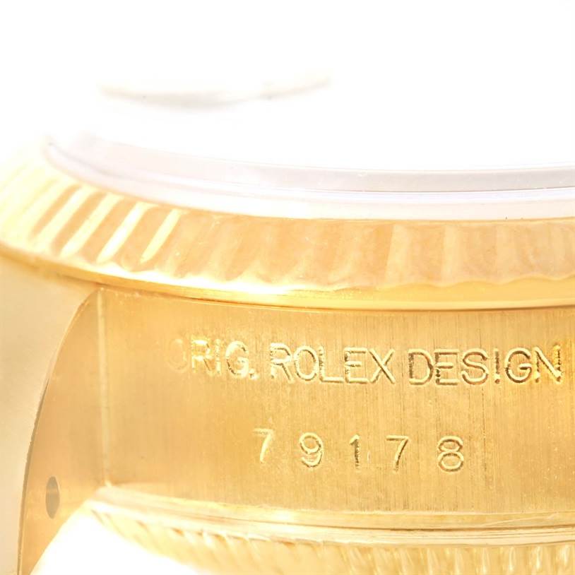 The image shows a close-up of the gold casing and model engraving on a Rolex President 79178 Women's Yellow Gold Beige Dial 79178 Women's Yellow Gold Beige Dial watch.