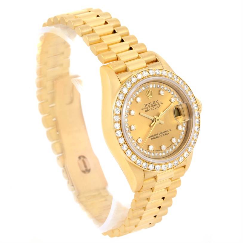This image shows a Rolex President 69138 Women's Yellow Gold Champagne Dial 69138 Women's Yellow Gold Champagne Dial watch from a front-left angle, highlighting its gold bracelet, dial, and diamond bezel.