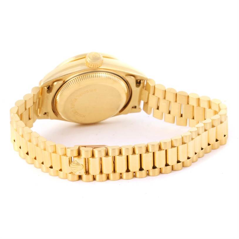 This image shows the back case and bracelet clasp of a Rolex President 69138 Women's Yellow Gold Champagne Dial 69138 Women's Yellow Gold Champagne Dial model watch at a rear angle.