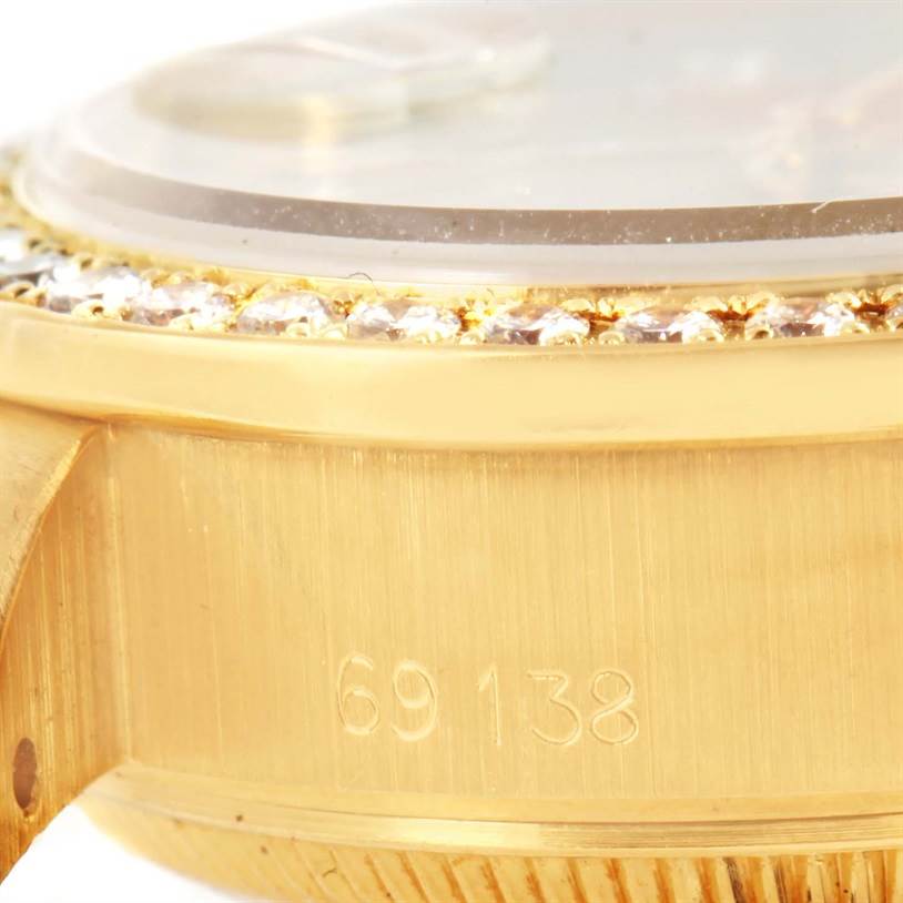 This close-up image shows the case side and bezel of a Rolex President 69138 Women's Yellow Gold Champagne Dial 69138 Women's Yellow Gold Champagne Dial model watch, displaying its model number 69138.