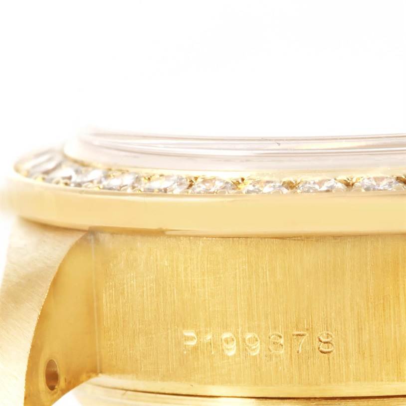 This close-up image of the Rolex President 79138 Women's Yellow Gold Silver Dial 79138 Women's Yellow Gold Silver Dial watch shows the side of the case, bezel with diamonds, and a partial serial number.