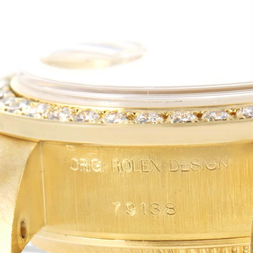 The image shows the side view of the case and bezel of a Rolex President 79138 Women's Yellow Gold Silver Dial 79138 Women's Yellow Gold Silver Dial model, featuring "ORIG. ROLEX DESIGN" and "79138".