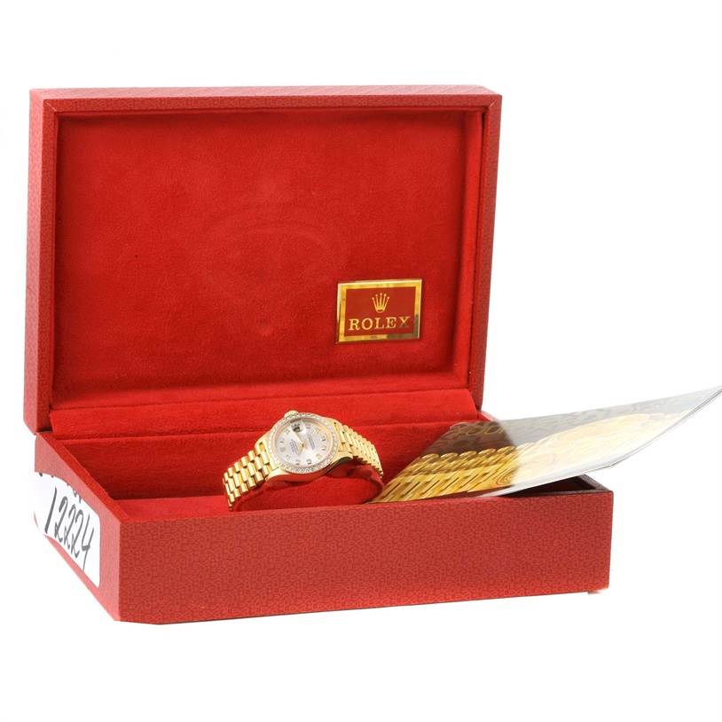 The Rolex President 79138 Women's Yellow Gold Silver Dial 79138 Women's Yellow Gold Silver Dial model is shown in an open red box, angled to display the watch face and bracelet.