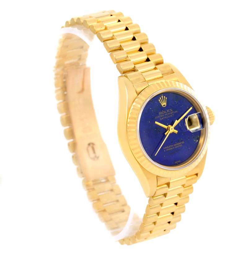The image shows a Rolex President 69178 Women's Yellow Gold Blue Dial 69178 Women's Yellow Gold Blue Dial model watch angled slightly from the side, displaying its gold bracelet and blue dial with date complication.