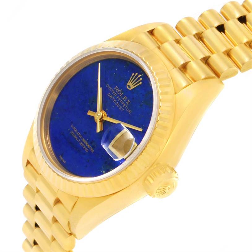 The image shows a Rolex President 69178 Women's Yellow Gold Blue Dial 69178 Women's Yellow Gold Blue Dial model watch at an angle, highlighting its blue dial, gold case, crown, and bracelet.